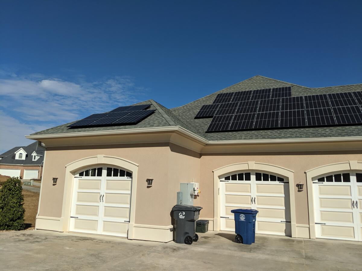 Three car garage with many solar panels