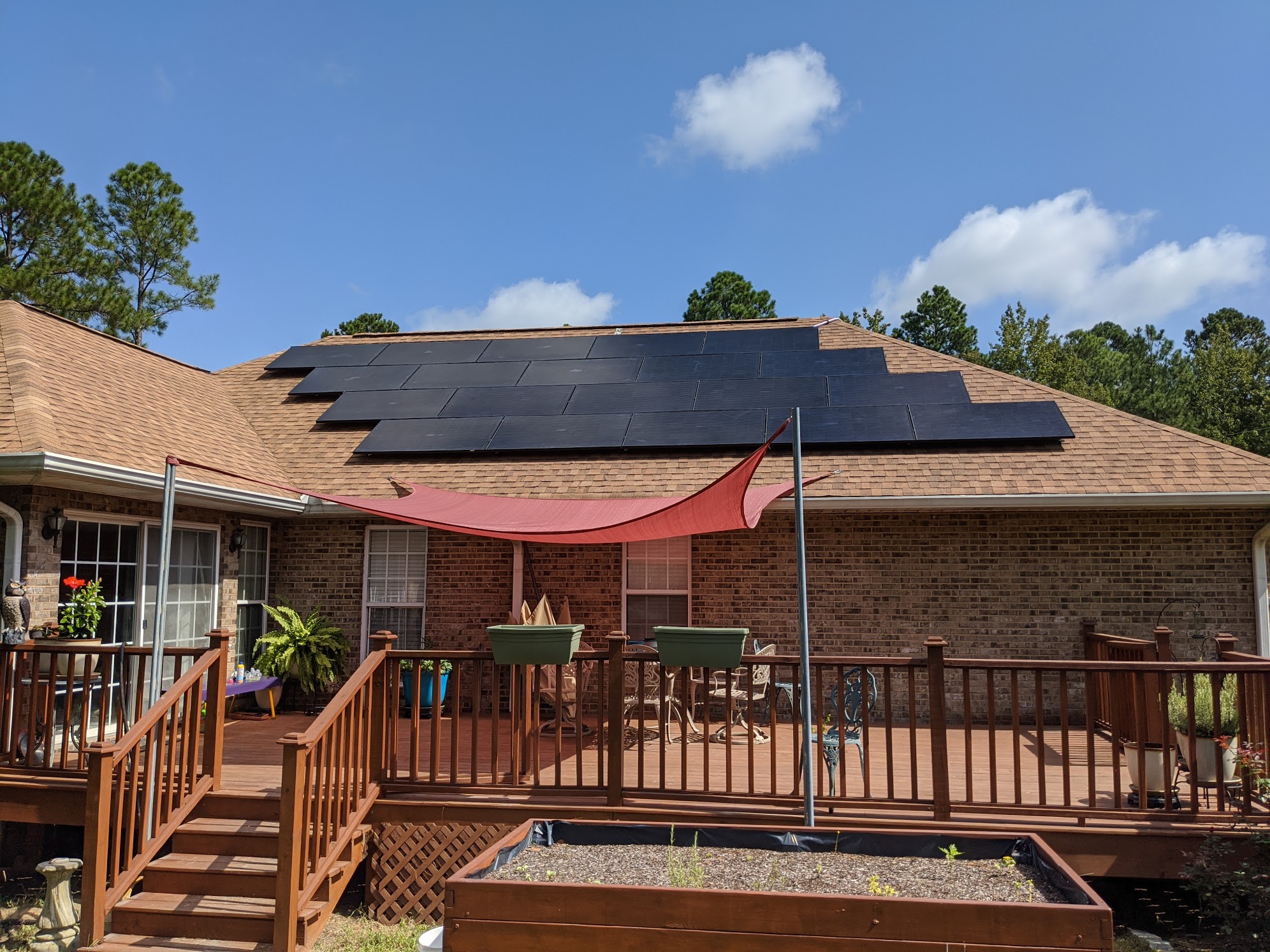 Solar panels on back of house by deck