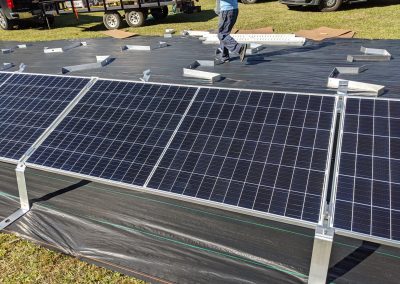 To keep the panels low to the ground, we used a ballasted racking system on this grid tie with battery backup system in Thomasville, Georgia.