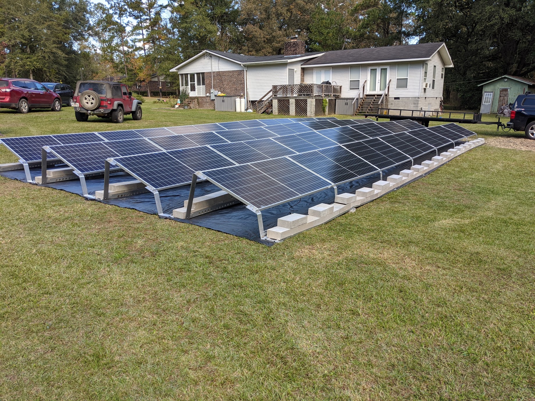 Image 2 - To keep the panels low to the ground, we used a ballasted racking system on this grid tie with battery backup system in Thomasville, Georgia.