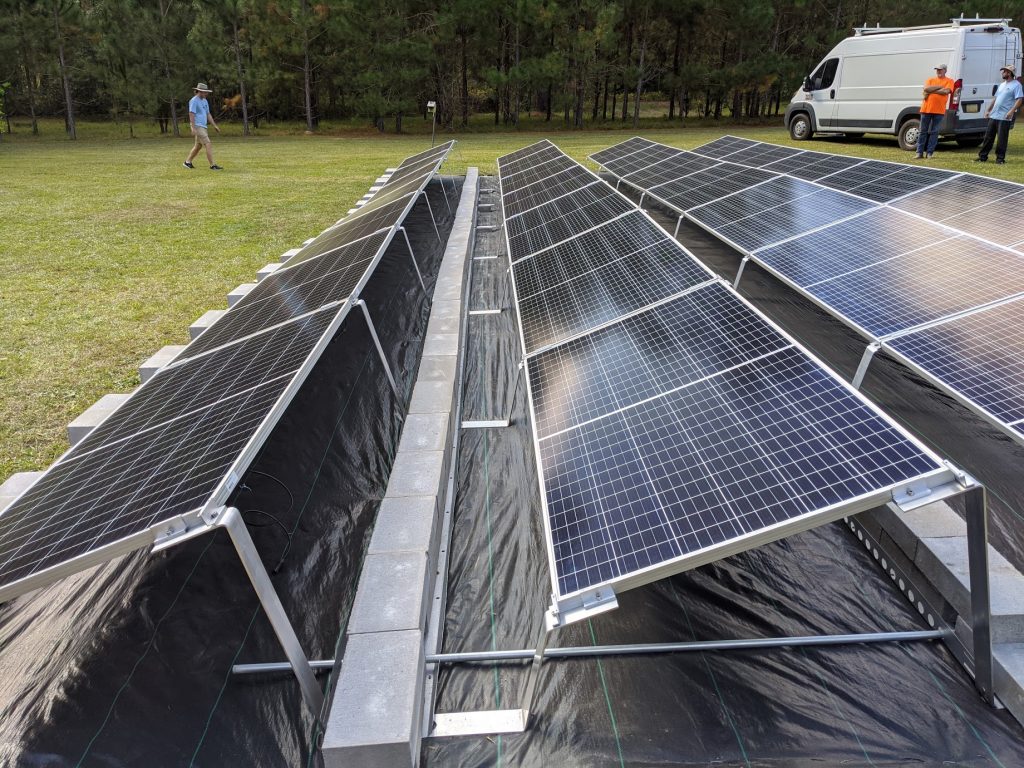 Image 3 - To keep the panels low to the ground, we used a ballasted racking system on this grid tie with battery backup system in Thomasville, Georgia.